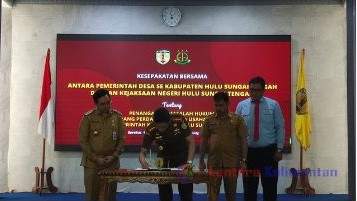 Proses penandatanganan MoU yang dilakukan Kepala Kejari HST Faizal Banu dan disaksikan langsung Bupati HST H Aulia Oktafiandi. Photo : ID/lenterakalimantan.com